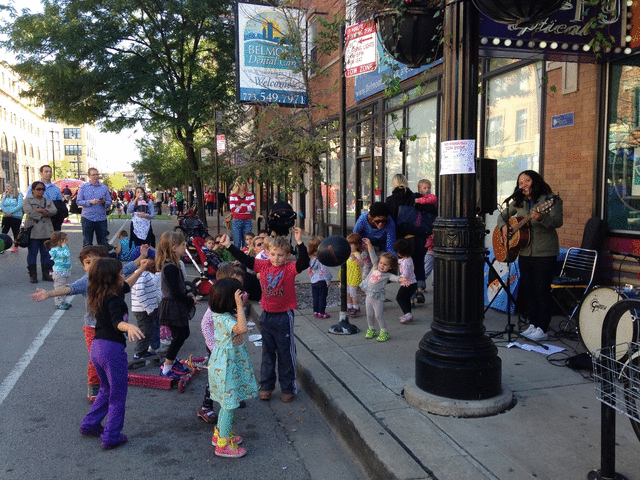 Kids dance to the music of "Little Miss Ann" Torrlba at a Sunday Play Spot event.