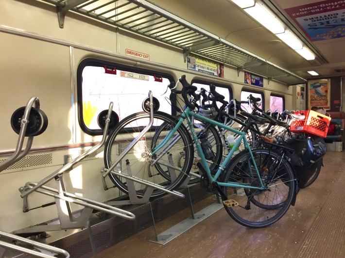 Seats are removed to accommodate bike racks to hold bikes during the trip.