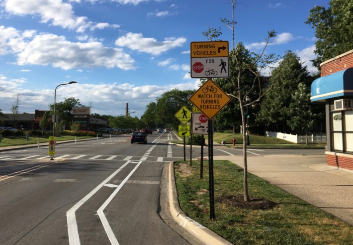Lots of signs on Dodge bike lane