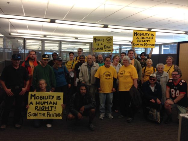 Members of Seattle's Transit Riders United at a King County Council meeting where they called for expanding the city's discount transit fare program. Photo: TRU