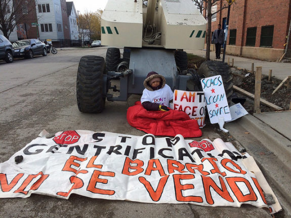 Maria Calvilla, 58, locked to a cement barrel behind a crane. Photo: Lynda Lopez