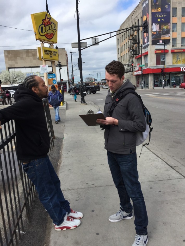 An Active Trans staffer interviews a CTA customer about bus service on Pulaski. Photo: CTA
