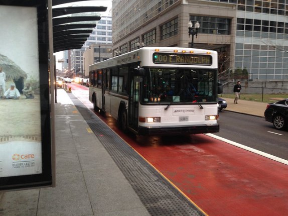 An Aries Charter Transportation bus in a Loop Link lane.