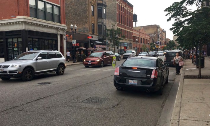 Illegal parking sometimes blocks crosswalks at Milwaukee Honore -- new bumpouts will help prevent this. Photo: CDOT