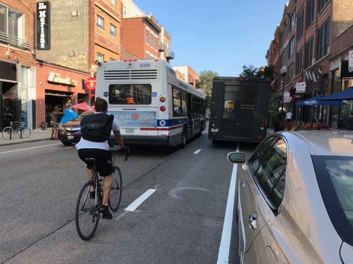 Dashed bike lanes are making Milwaukee Avenue somewhat more bikeable, but it's still not Amsterdam. Photo: John Greenfield