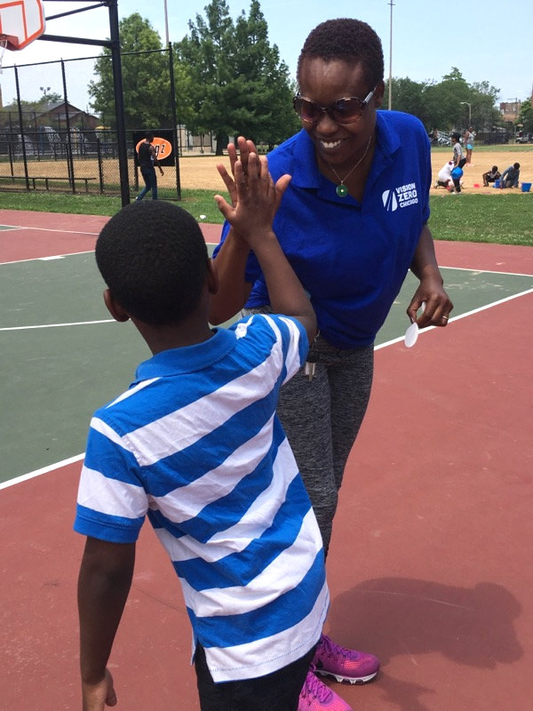 Vision Zero community organizer Shameka Turner and a young resident at the WGCI Peace in the Streets Block Party in July. Photo: CDOT