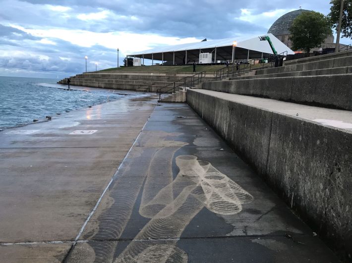 Were these Slinky-like markings on the concrete caused by a park district algae-scrubbing machine? Photo: John Greenfield