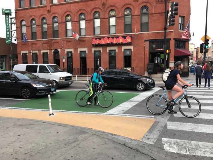 The addition of the bike box and curb extensions at the north leg of the intersection involved banning right turns by southbound drivers on Damen. Photo: John Greenfield
