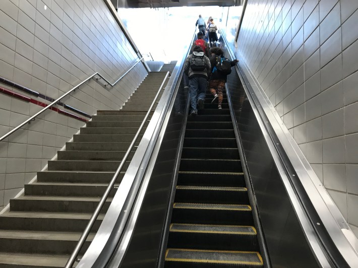 The new up escalator. Customers exiting the station still have to walk down a long flight of stairs. Photo: John Greenfield