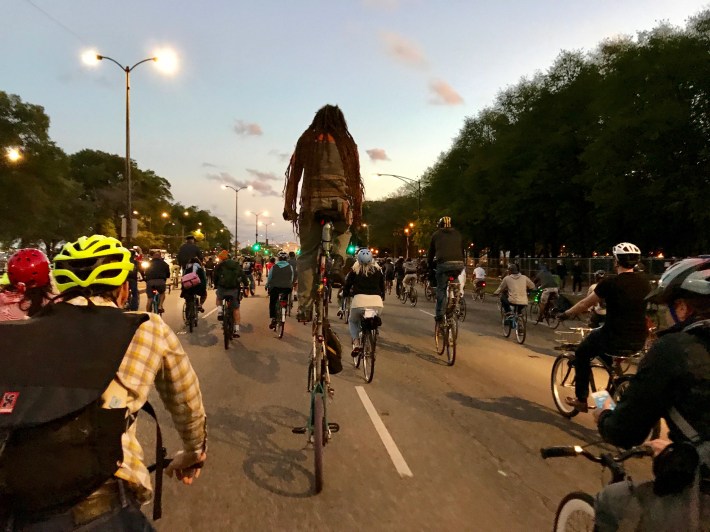 Yly Coyote rides a tall bike on LAke Shore Drive during the anniversary ride. Photo: John Greenfield