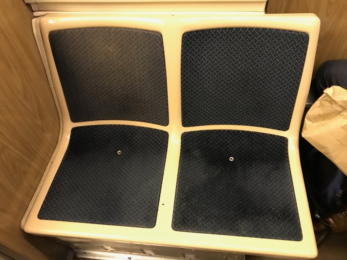 Riders say the older-style cloth seat panels can conceal spills and contamination. Photo: John Greenfield