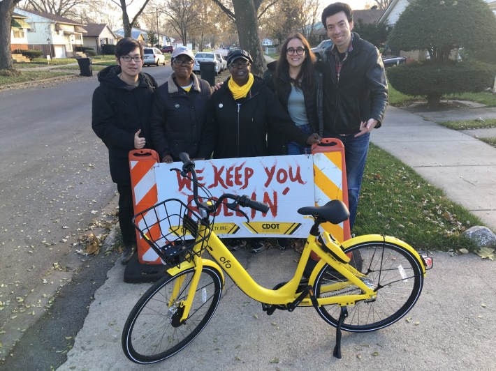 Staff from the Riverdale-based bike group We Keep You Rollin', Ofo, and the Shared Use Mobility Center with one of the bike library cycles. Photo: We Keep You Rollin'.