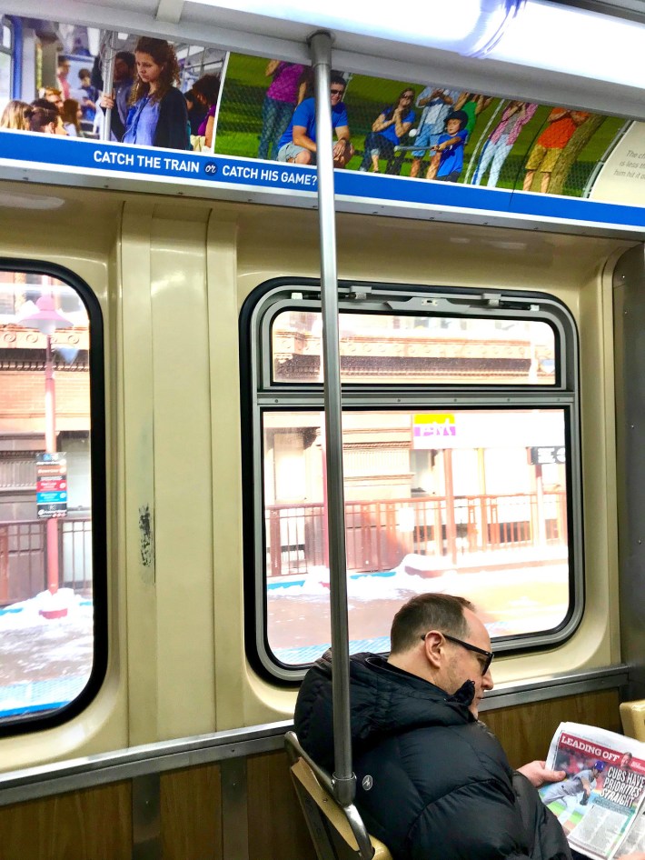 A Brown Line add asks "Catch a train or catch his game?" Photo: John Greenfield