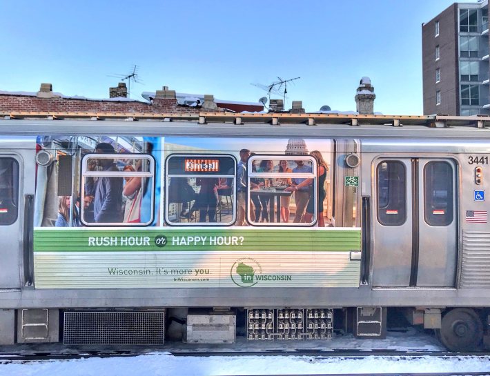 A Wisconsin ad on a Brown Line train. Photo: Michelle Stenzel