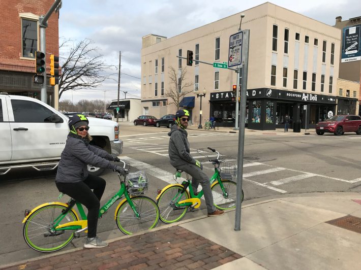 LimeBike staffers Gwen Jones and Will Piper on the East State Street business strip. Photo: John Greenfield