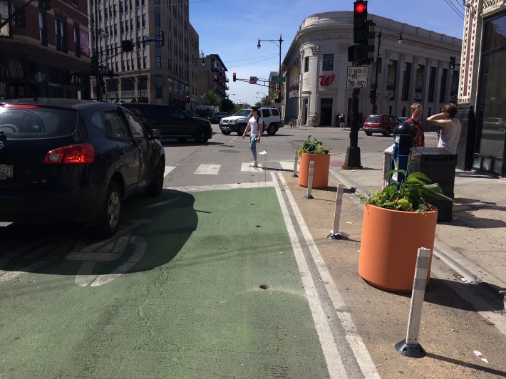 Steven says the planters at this location take away space that cyclists have been using for queueing. Photo: Steven Vance