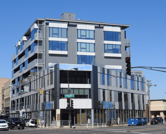 The new TOD. The closed slip lane, which was modified with paint and posts, is visible in front of the building. Photo: LG Partners