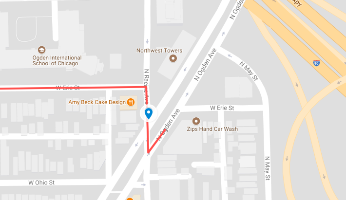 Red line shows the path an eastbound driver on Erie would have taken to turn northeast on Ogden. The blue marker shows the cyclist's possible location at the time of the crash. Image: Google Maps