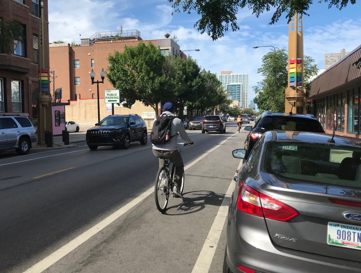 A cyclist rides on Halsted in Boystown. Photo: John Greenfield