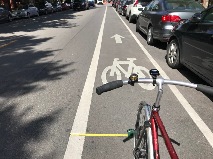 I consistently ride about two feet from the left edge of bike lanes of various widths, and it appears many other cyclists do too. Photo: John Greenfield