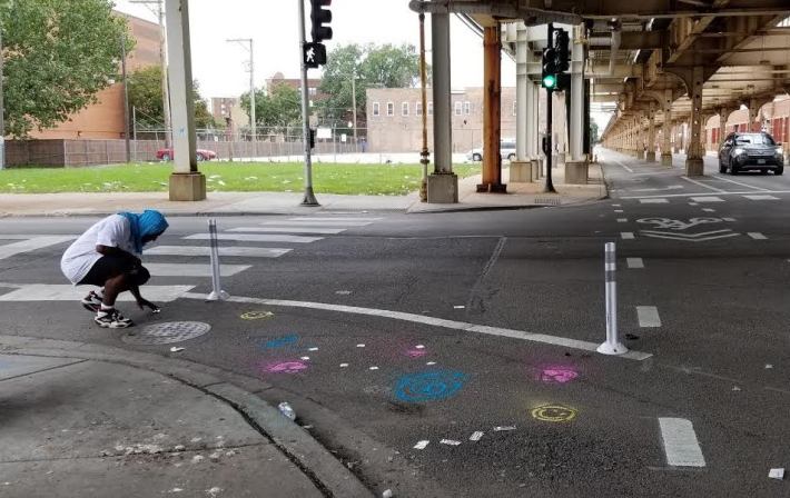 Resident chalking the intersection