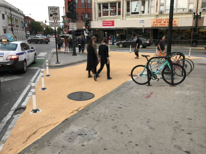 The city turned dangerous slip lanes in gentrified Wicker Park into pedestrian space. These kinds of improvements are also needed in lower-income communities. Photo: John Greenfield