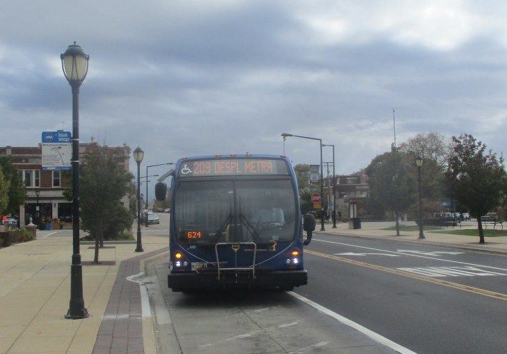A route 209 bus arrives at Harlem Blue Line 'L' station on Saturday afternoon. Photo: Igor Studenkov