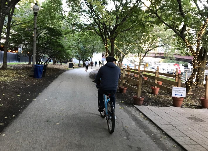 Biking on the older section of the riverwalk near the Lakefront Trail. Photo: John Greenfield