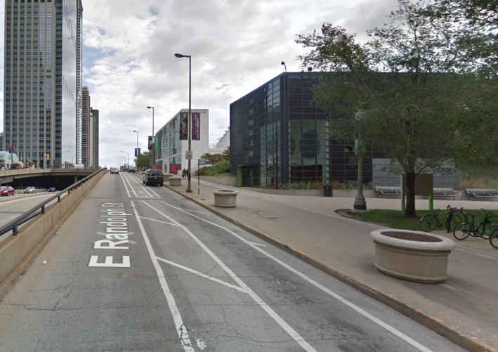 Just south of the Harris Theater, the bike lane was moved to the left in recent years to create a legitimate loading zone. Image: Google Maps