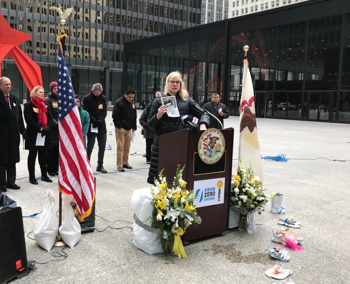 Janna Henning holds up a photo of her former partner Patrick Stack, who was killed on his bicycle at Huron and Orleans in 1989. Photo: John Greenfield