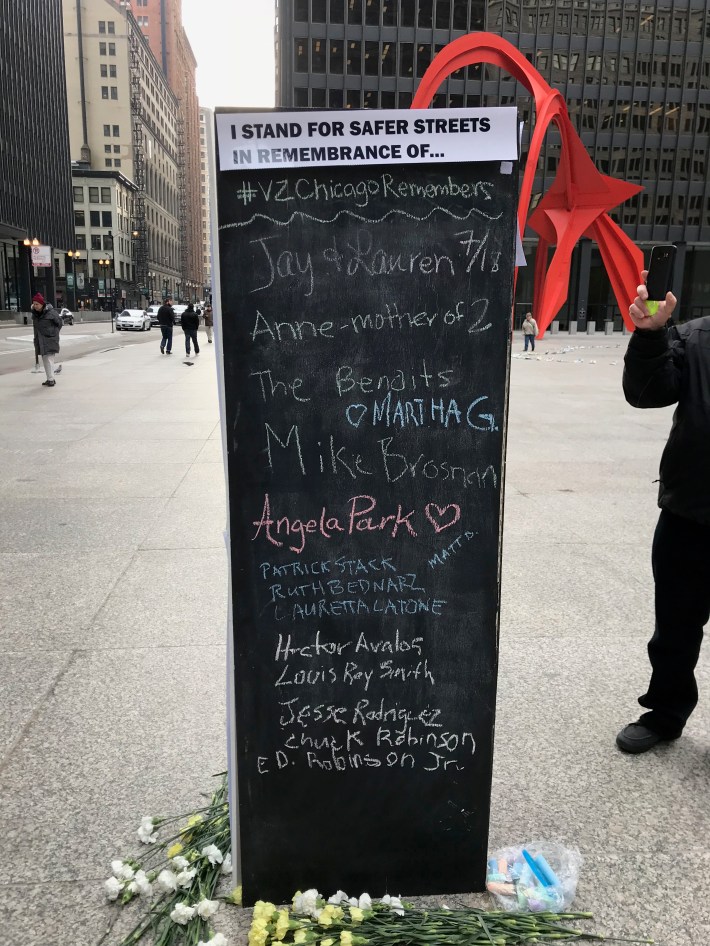 Victims names were written in chalk on a display at the palza. Photo: John Greenfield