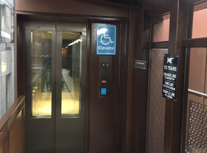 The new elevators feature old-timey signs. Photo: CTA