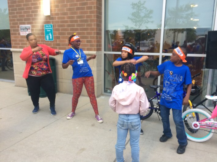 Dancing to DJ Gemini Jones' music before the ride. Photo: James Porter