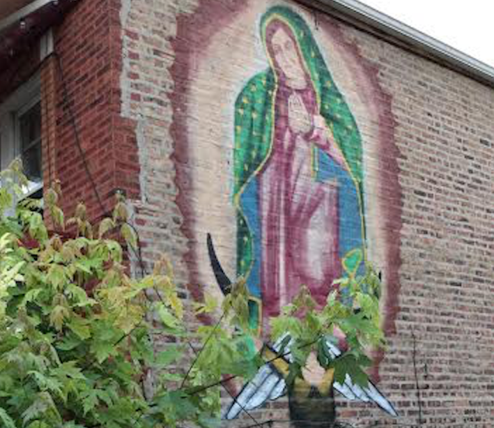 A painting of La Virgen de Guadalupe on the side of a home in Pilsen. Photo: Lynda Lopez