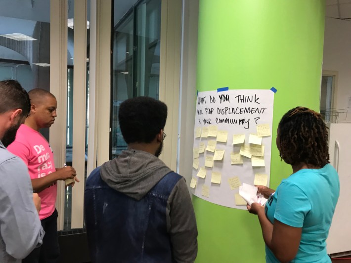 Participants answer questions about displacement with Post-Its. Photo: John Greenfield