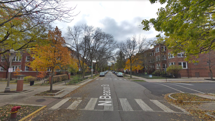 The intersection of Sunnyside and Beacon, looking south, with the pedestrian mall entrance on the left. The parking lot is already surrounded by dense 3-4-story multifamily buildings. Image: Google Maps