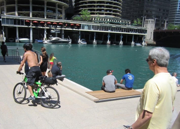 Were the angles of the riverwalk near the bridges designed to facilitate cycling or thwart it? Photo: John Greenfield