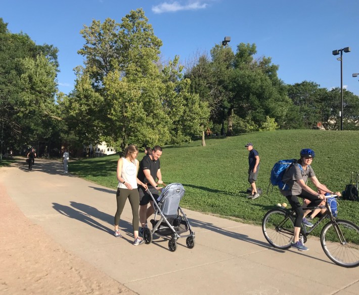 A person on a bike shares the Oz Park path with people walking. Photo: John Greenfield