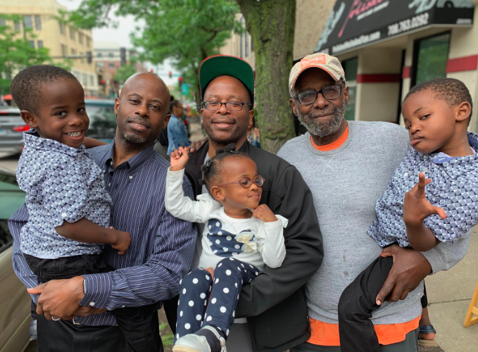 Reed (middle) with his brother Khari (left) and father Dwight (right), along with his nephew Noah, niece Layla Grace, and nephew Ajani (left to right).