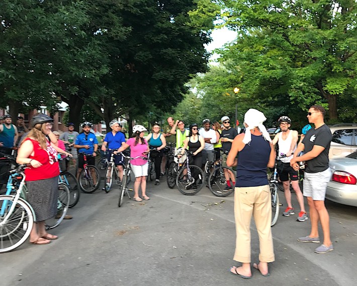 47th Ward Alderman Matt Martin, far right, listens to a presentation by a community gardener at a Ward bike ride on August 2. Photo: John Greenfield