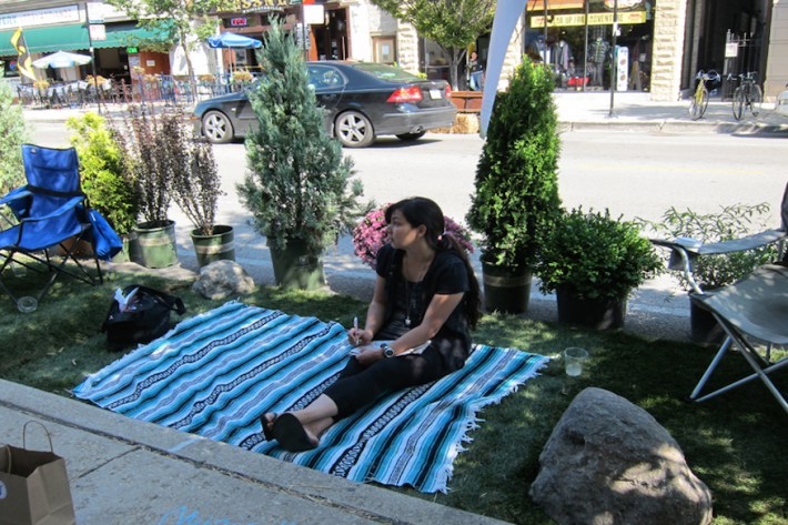 Relaxing in the Southport PARK(ing) day parklet. Photo: Moss Design