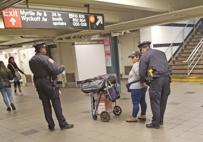One of two women who were cuffed by the NYPD for selling churros in the subway. Photo: Rafael Martinez via Streetsblog NYC