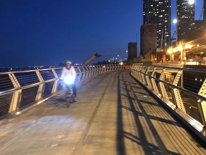 The cantilevered structure will eventually pass through the bridge houses. Photo: John Greenfield