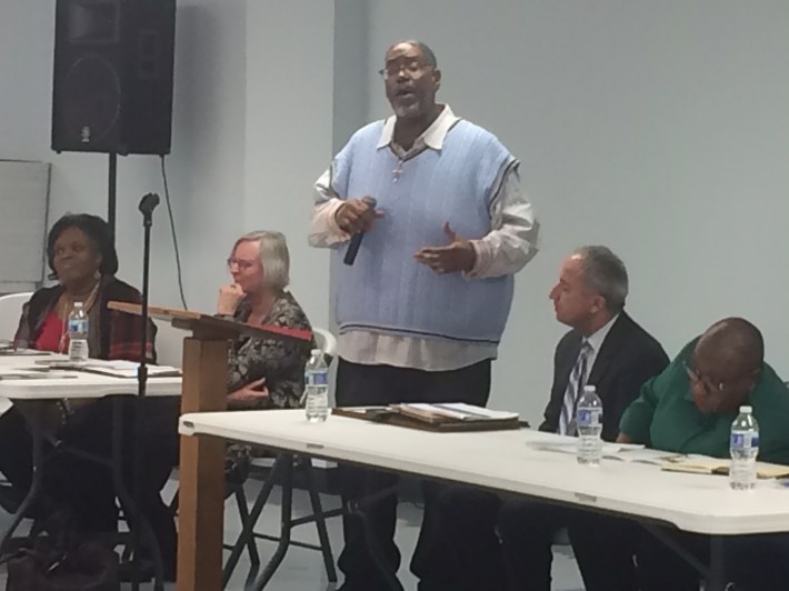 Pastor Luther Mason speaks at the event. Photo: James Porter