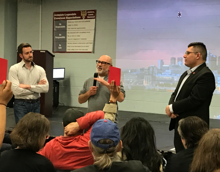 Mark Fishman testifies against the affordable TOD at the community meeting last April. To the right is Alderman Carlos Ramirez-Rosa. Photo: John Greenfield