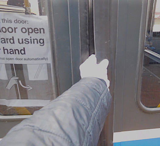 Grabbing the flap of the door to board the bus. Photo: Imelda March