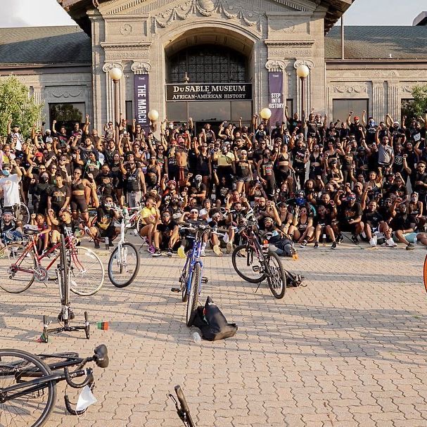 Streets Calling riders in front of DuSable Museum of African American History celebrating Juneteenth 2020. Photo taken by Genius Media Company.