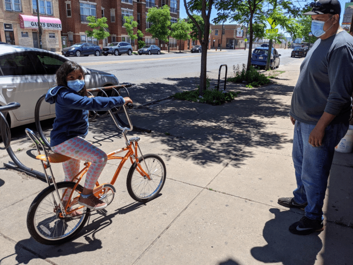 A young customer test-rides a cycle from Working Bikes. Photo courtesy of Working Bikes