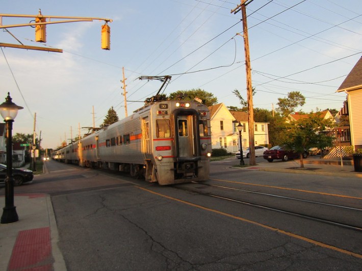 A South Shore train runs through the middle of the street in Michigan City. Photo: Igor Studenkov