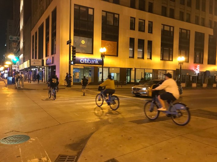 People riding Divvies on Michigan Avenue on a Friday night in early August. Photo: John Greenfield